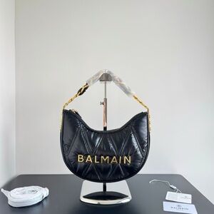 Balmain 1945 Soft Moon bag in diamond-quilted nylon bag